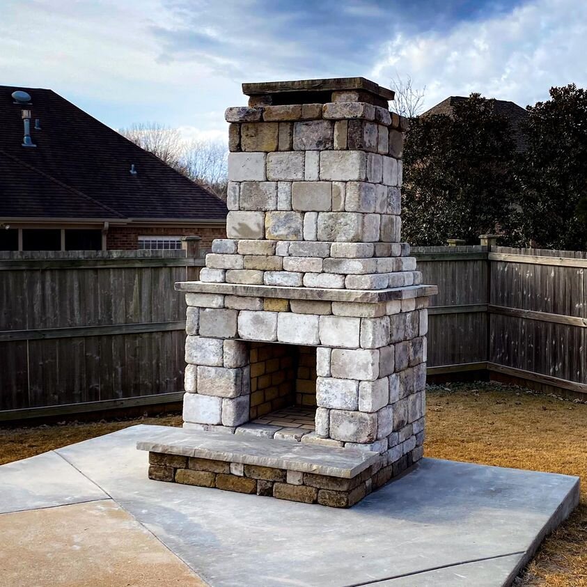 Outdoor stone fireplace on patio