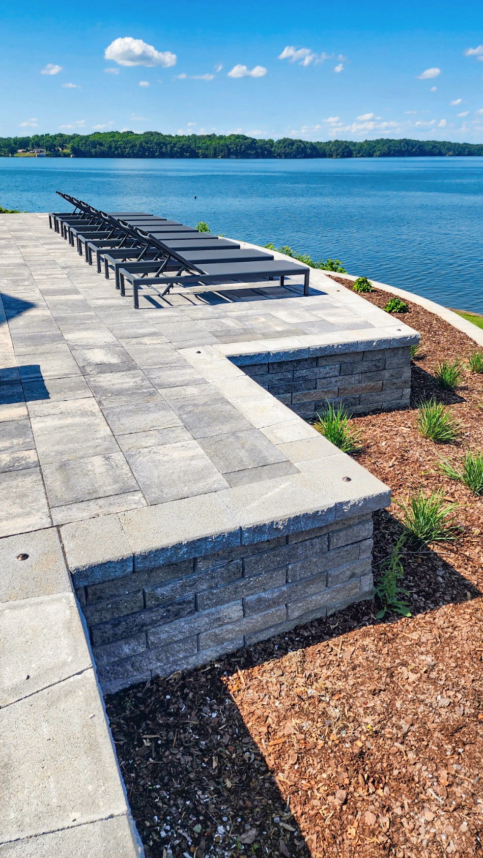 Lounge chairs overlooking a tranquil lake