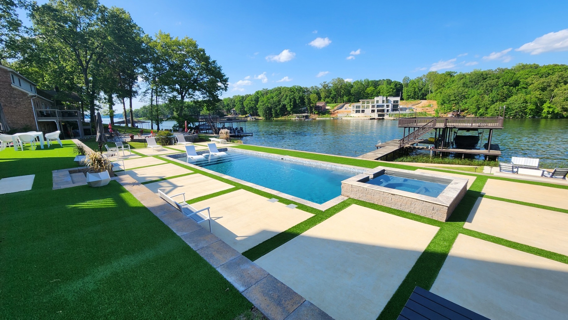 Lakeside pool with modern deck