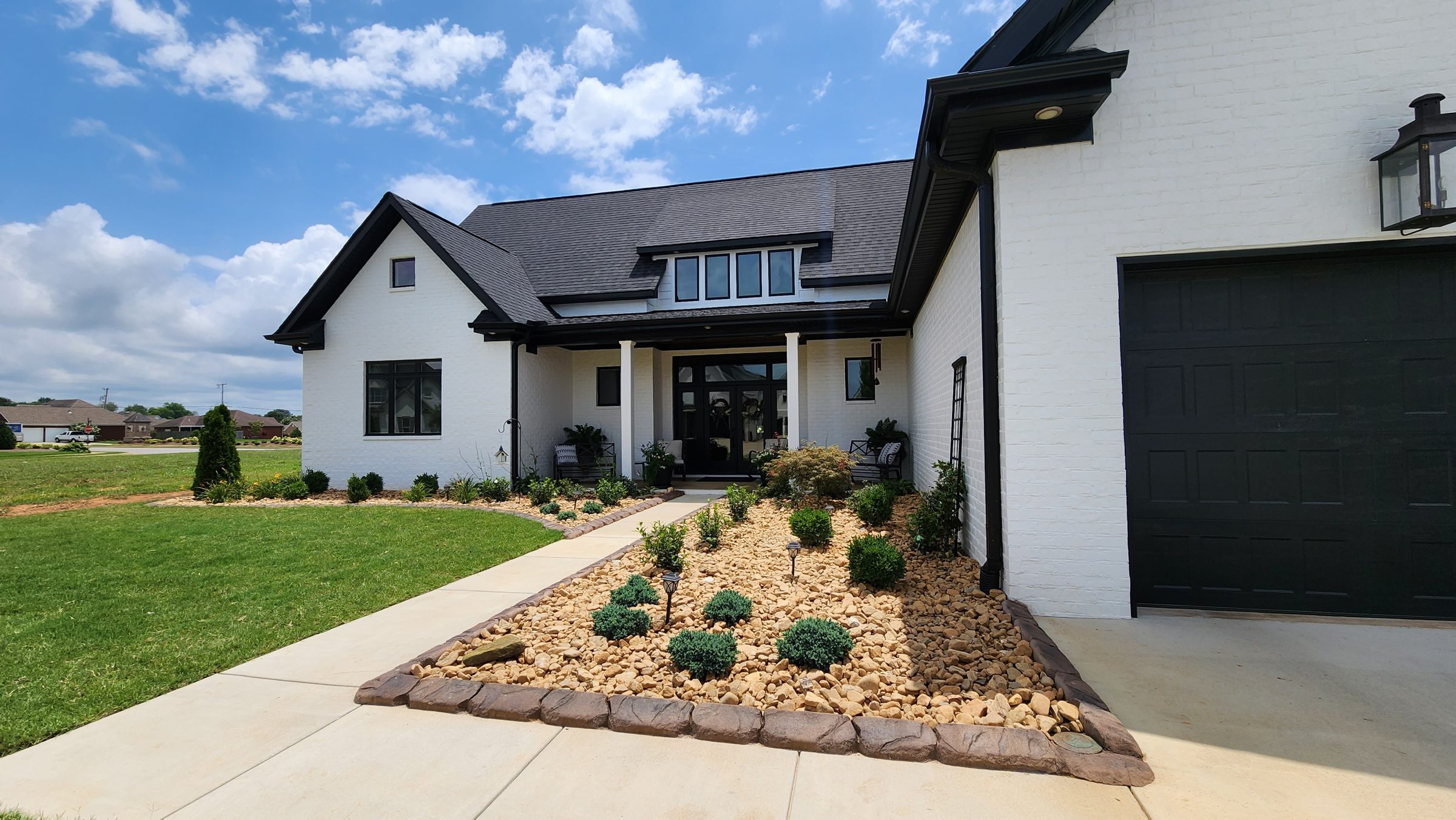 Modern house with landscaped front yard.