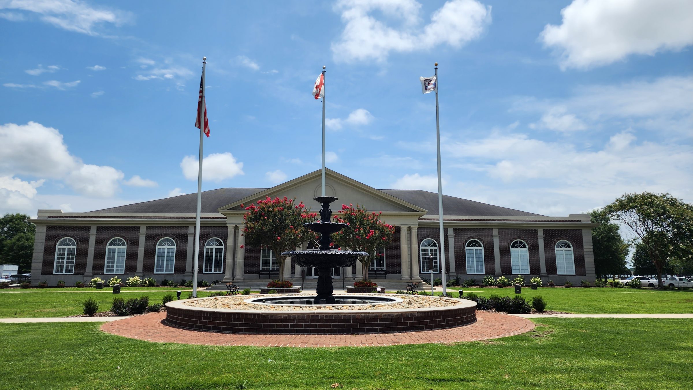 Elegant building with fountain and flags