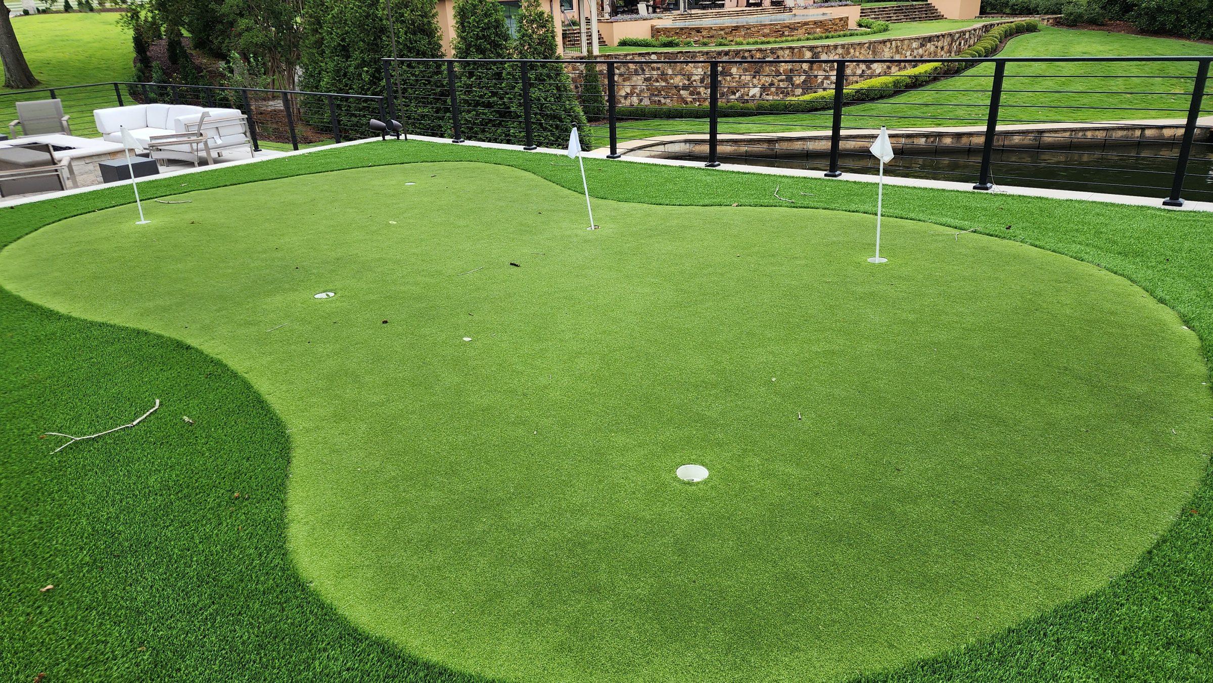Backyard putting green with seating area