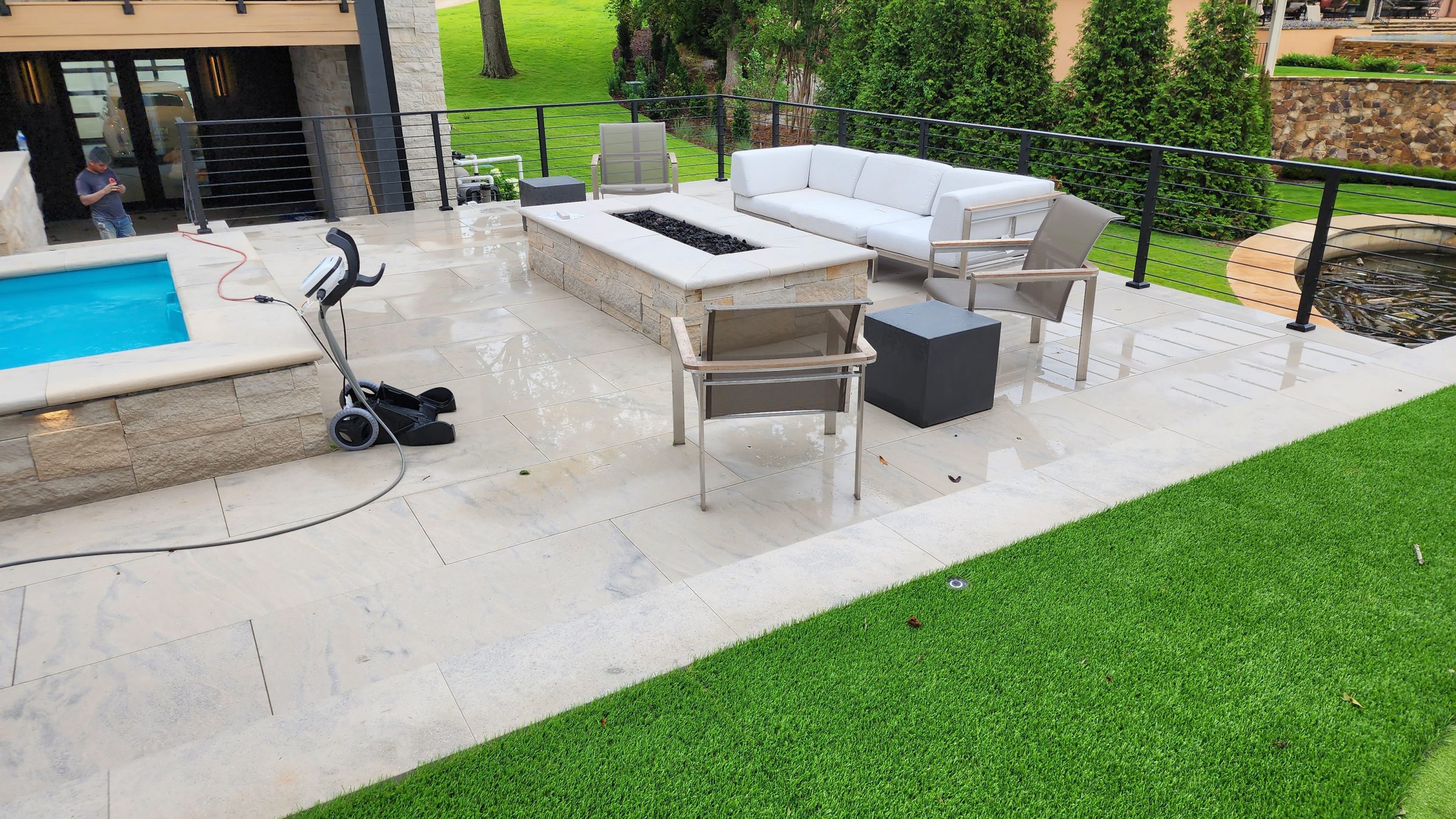 Modern outdoor patio with pool and seating