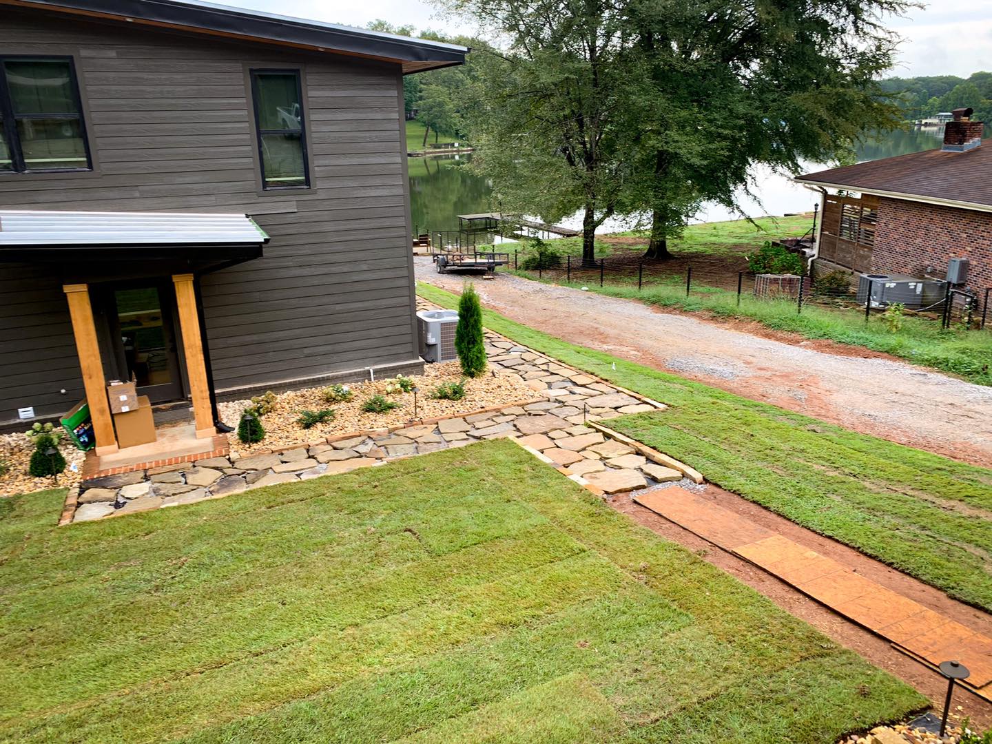 Lakeside house with landscaped lawn