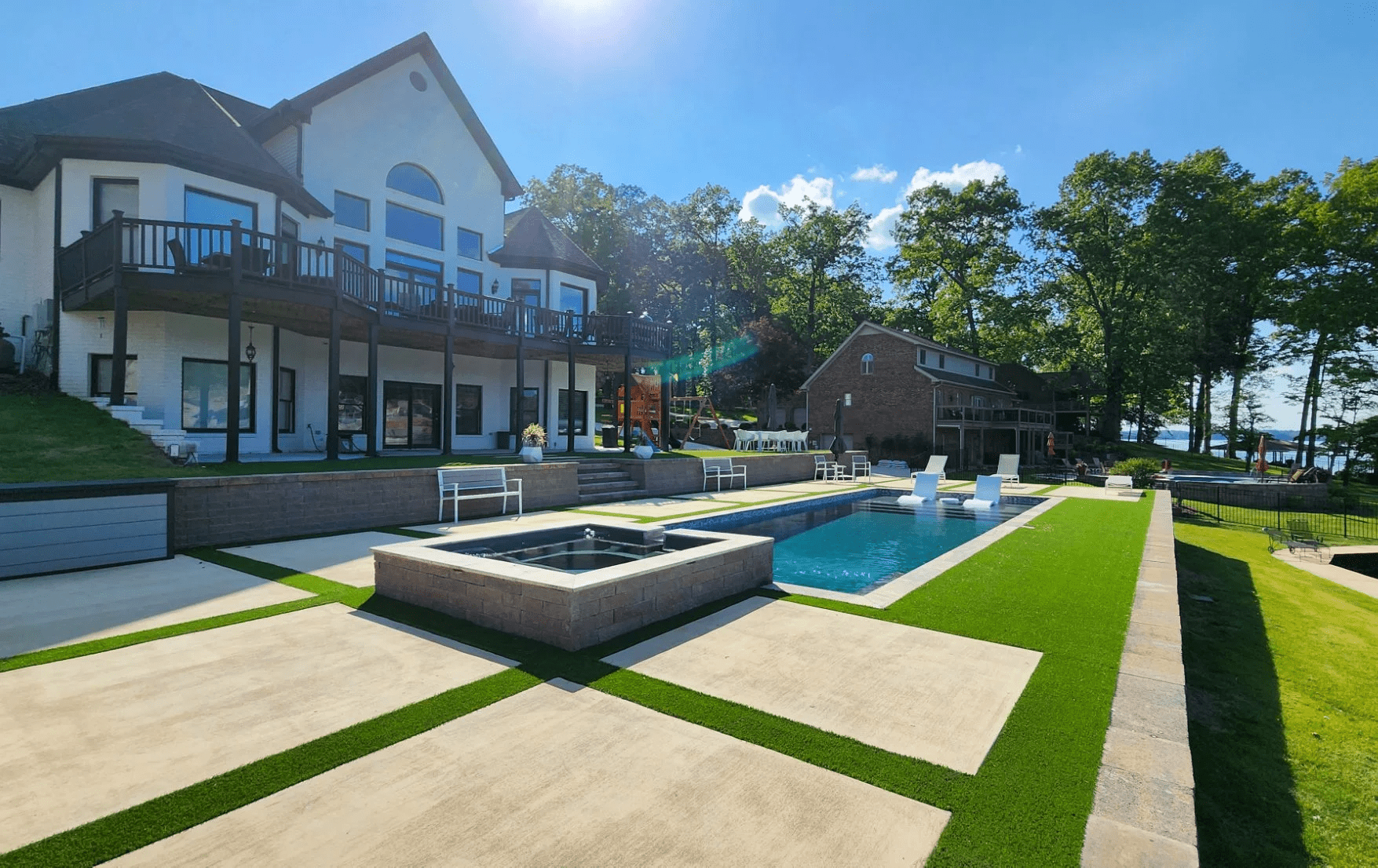 Modern house with pool and deck area.