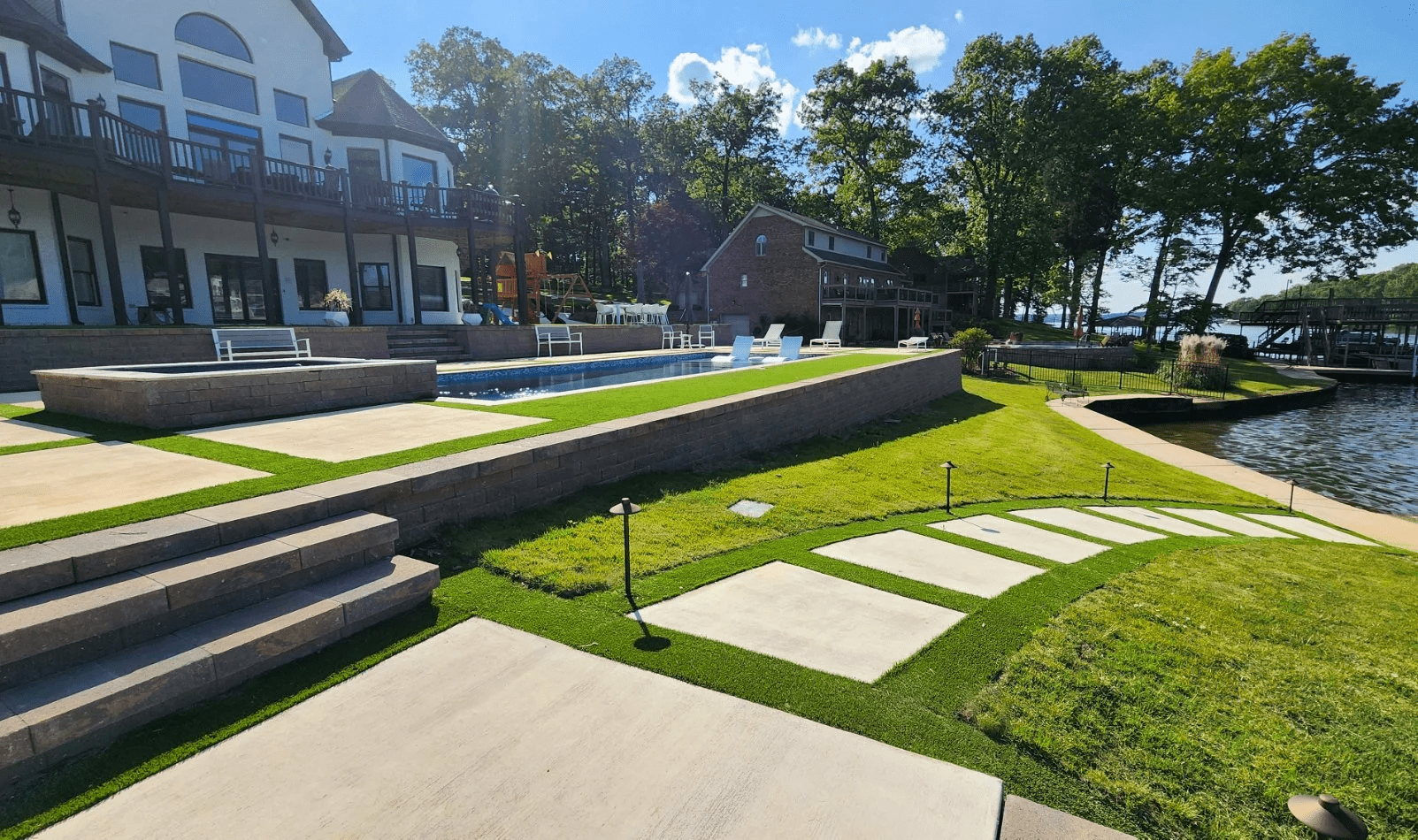 Luxurious lakeside home with pool and garden