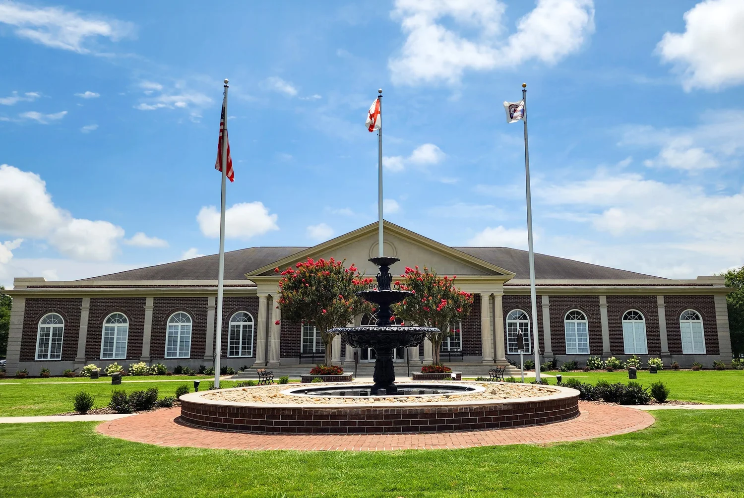 Fountain and flags outside a building