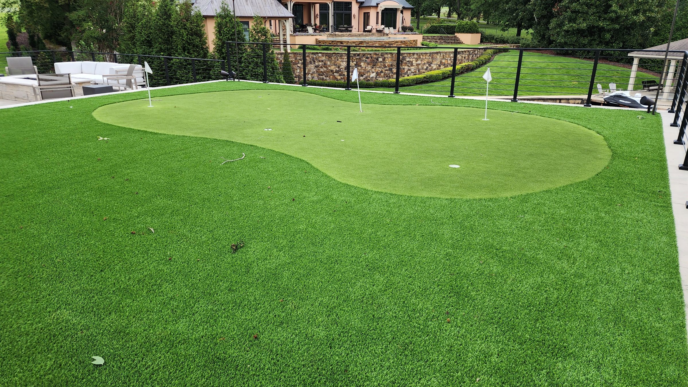 Rooftop synthetic putting green with flags