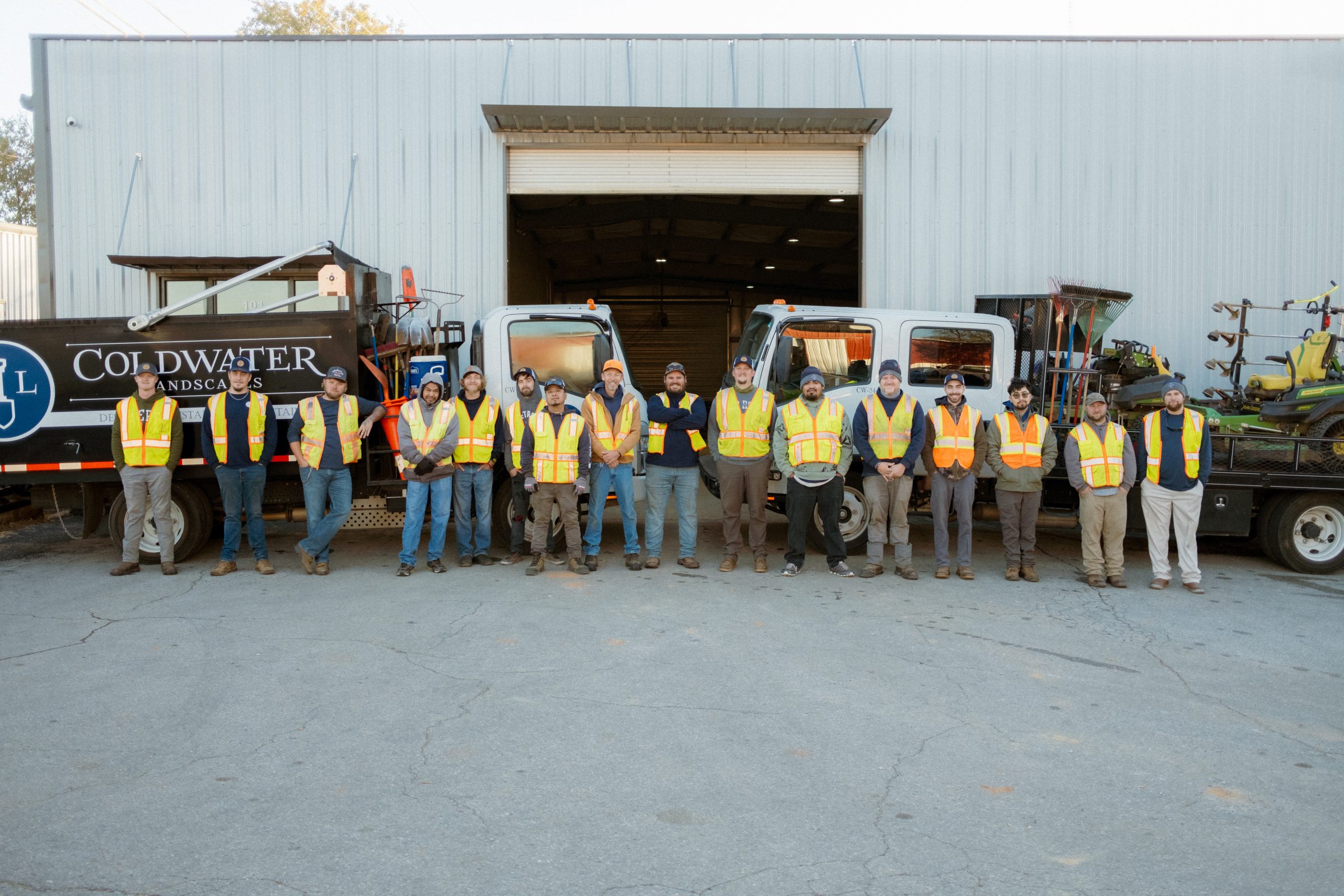 Team of landscapers in safety vests