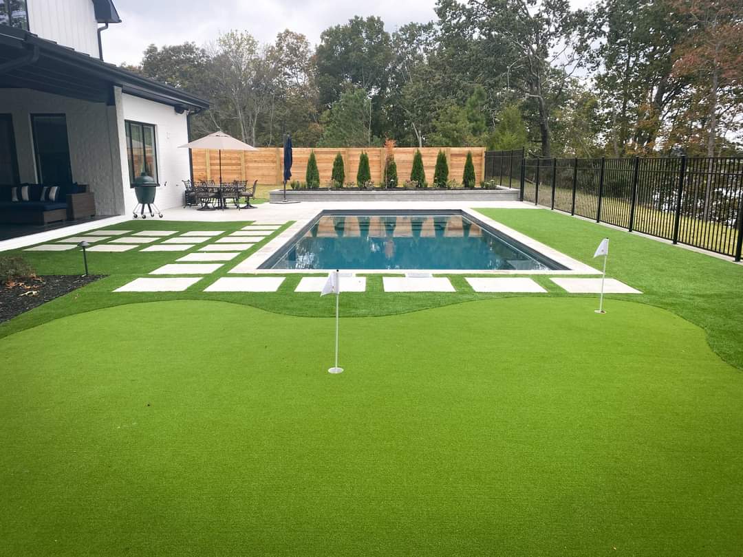 Backyard with pool and putting green