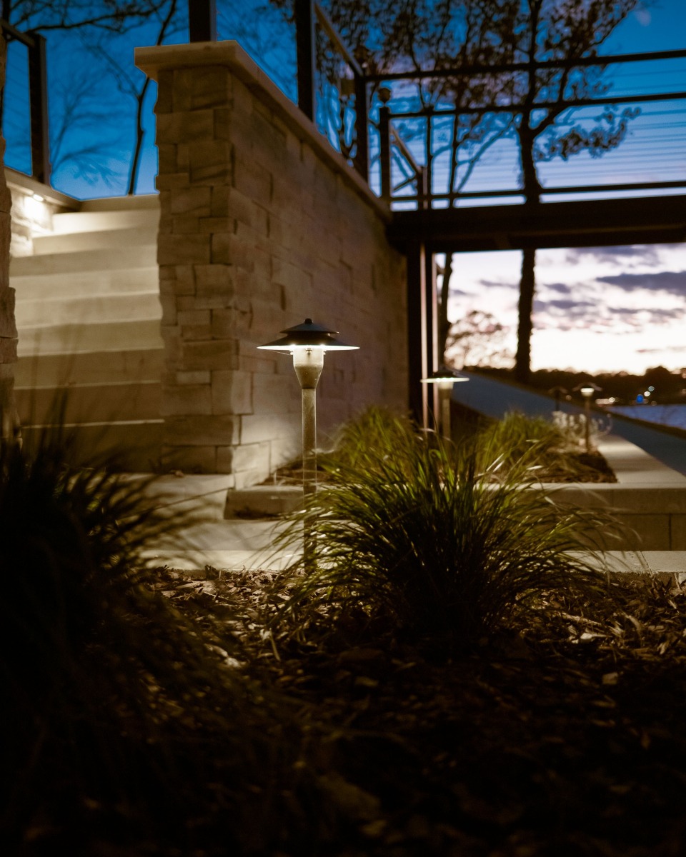 Outdoor stairs with garden lights at dusk