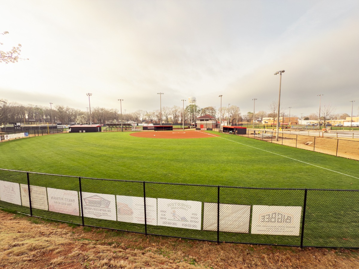Empty baseball field with green grass